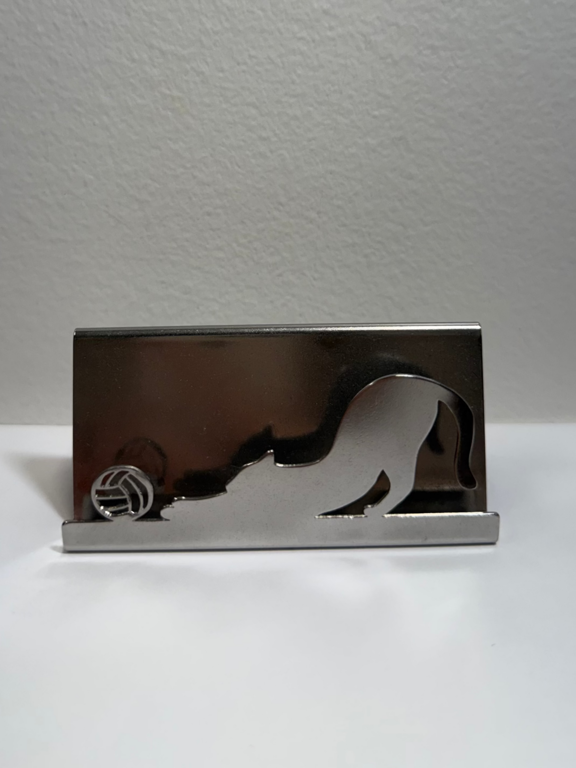Metallic business card holder with a cat design